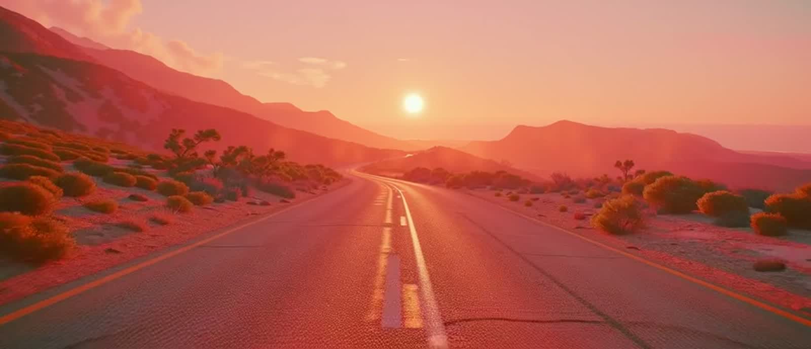 An empty desert highway at sunset